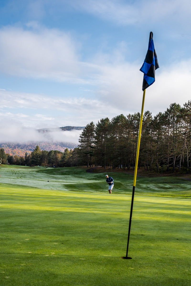 a flag on a golf green